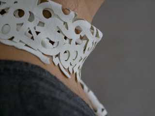 Illustration for article titled Laser-Cut Scarfs. Verdict: Fashion and Laser Beams FTW!